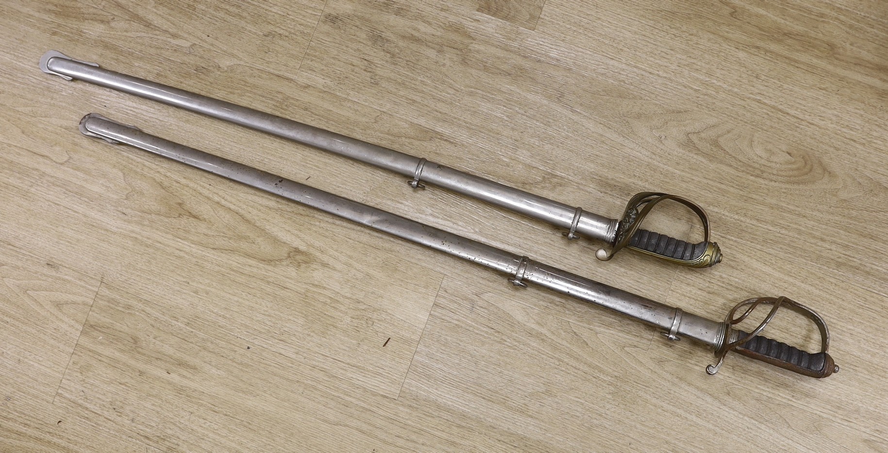 A Royal Artillery officers sword and a Hamburger Rogers & co. 1845 pattern officers sword. Both with scabbards